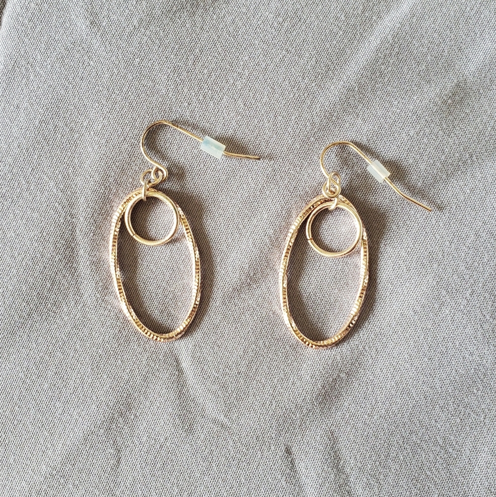 Rose gold toned earring set.